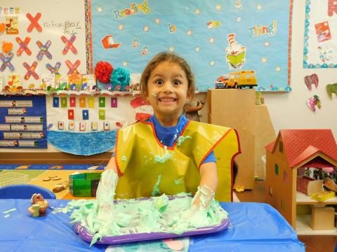 Aiden Bentiste enjoys playing with green plastic eggs during a sensory session at the Soboba Tribal Preschool during its weeklong Dr. Seuss birthday celebration Aiden Bentiste enjoys playing with green plastic eggs during a sensory session at the Soboba Tribal Preschool during its weeklong Dr. Seuss birthday celebration