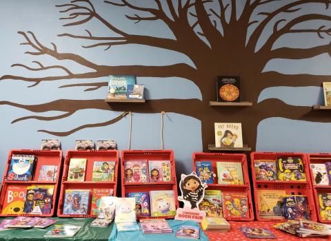 Some of the books at this spring’s Scholastic Book Fair are displayed under a tree mural created by Soboba Tribal Preschool Administrator Lenora “Ponie” Mojado, who was an Instructional Aide at the school in 2020 when she painted it Some of the books at this spring’s Scholastic Book Fair are displayed under a tree mural created by Soboba Tribal Preschool Administrator Lenora “Ponie” Mojado, who was an Instructional Aide at the school in 2020 when she painted it
