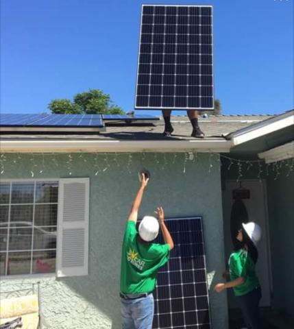 Noli Indian School student Steve Medina, on roof, is handed photovoltaic solar panels from GRID Alternatives volunteers during a recent installation at the Soboba Reservation as part of the Solar Futures program Noli Indian School student Steve Medina, on roof, is handed photovoltaic solar panels from GRID Alternatives volunteers during a recent installation at the Soboba Reservation as part of the Solar Futures program