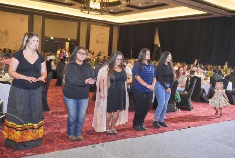 Guests, including honored students, dance during the social bird songs by Wayne Nelson of the Inter-Tribal Bird Singers Guests, including honored students, dance during the social bird songs by Wayne Nelson of the Inter-Tribal Bird Singers
