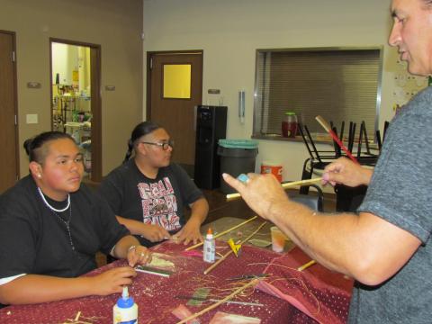 Andrew Alto, left, listens to instructor Tony Soares during an arrow-making workshop on July 23 Andrew Alto, left, listens to instructor Tony Soares during an arrow-making workshop on July 23