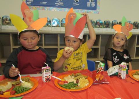 Pre-K students enjoy their turkey lunches while wearing the turkey-themed hats they made during class. From left, Hezekiah Smith, Tuukut Adame and Rihanna Kashersky Pre-K students enjoy their turkey lunches while wearing the turkey-themed hats they made during class. From left, Hezekiah Smith, Tuukut Adame and Rihanna Kashersky