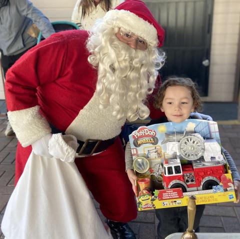 Santa delights a child with a new toy at the My City Youth Center Christmas event on Dec. 17. The Hemet nonprofit received 100 gifts from this year’s Soboba Gives Back! Toy Drive. Photo by Soboba Band of Luiseño Indians Santa delights a child with a new toy at the My City Youth Center Christmas event on Dec. 17. The Hemet nonprofit received 100 gifts from this year’s Soboba Gives Back! Toy Drive. Photo by Soboba Band of Luiseño Indians
