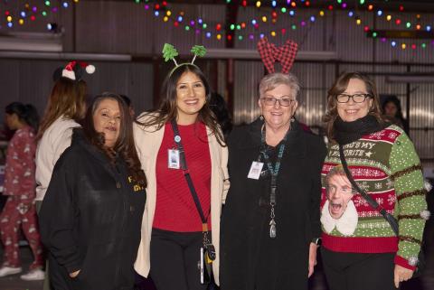 Among the hundreds of volunteers helping to Unstuff the Bus are, from left, Sonia Ramos, Stefany Curiel, Dawn Lawrence and Cyndi Lemke Among the hundreds of volunteers helping to Unstuff the Bus are, from left, Sonia Ramos, Stefany Curiel, Dawn Lawrence and Cyndi Lemke