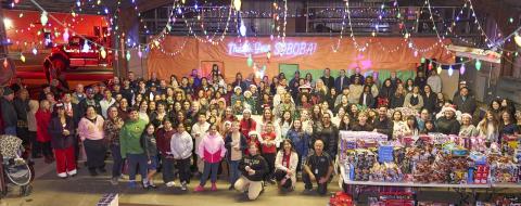 A group photo is taken after all the toys have been unloaded from the bus at San Jacinto Unified School District’s warehouse. It has become an annual tradition to have the photo taken A group photo is taken after all the toys have been unloaded from the bus at San Jacinto Unified School District’s warehouse. It has become an annual tradition to have the photo taken