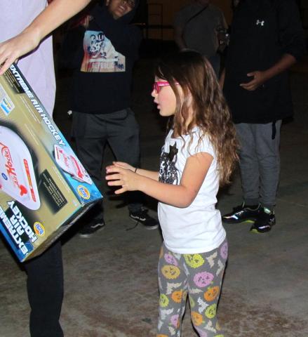 Lilly Andressen, 6, was one of about 200 community members who pitched in to “Unstuff the Bus” of toys donated from Soboba Gives Back Toy Drive to San Jacinto Unified School District Lilly Andressen, 6, was one of about 200 community members who pitched in to “Unstuff the Bus” of toys donated from Soboba Gives Back Toy Drive to San Jacinto Unified School District