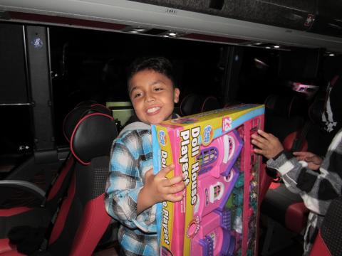 Ruben Valdez, 9, was one of several youths that helped unload toys from the bus to waiting community members who passed them along to be stored in San Jacinto Unified School District’s warehouse until its holiday distribution event on Dec. 14 Ruben Valdez, 9, was one of several youths that helped unload toys from the bus to waiting community members who passed them along to be stored in San Jacinto Unified School District’s warehouse until its holiday distribution event on Dec. 14