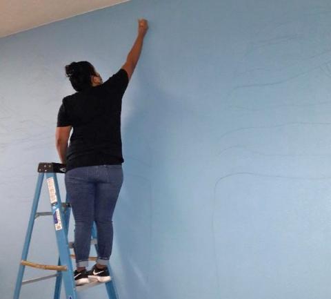 Lenora “Ponie” Mojado starts to freehand an outline for the story tree mural she started in August at the Soboba Tribal Preschool Lenora “Ponie” Mojado starts to freehand an outline for the story tree mural she started in August at the Soboba Tribal Preschool