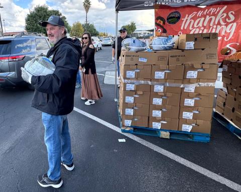 Soboba Foundation Vice President Julie Arrietta-Parcero, center, is joined by Hemet Unified School District volunteers David Bray, left, and Saul Romero at the drive-through turkey distribution event Soboba Foundation Vice President Julie Arrietta-Parcero, center, is joined by Hemet Unified School District volunteers David Bray, left, and Saul Romero at the drive-through turkey distribution event