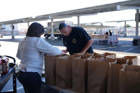 Hemet-San Jacinto Chamber of Commerce Executive Director Cyndi Lemke and Soboba Foundation Secretary Andy Silvas, fill bags with canned goods for distribution at the Soboba Gives Back! turkey meal giveaway at San Jacinto High School, Nov. 17. Photo courtesy of Carrie Best, SJUSD Hemet-San Jacinto Chamber of Commerce Executive Director Cyndi Lemke and Soboba Foundation Secretary Andy Silvas, fill bags with canned goods for distribution at the Soboba Gives Back! turkey meal giveaway at San Jacinto High School, Nov. 17. Photo courtesy of Carrie Best, SJUSD