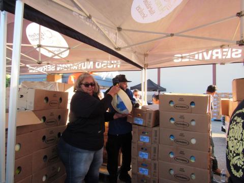 Soboba Foundation President Dondi Silvas hoists a 20-plus pound frozen turkey from its box to a waiting cart during the Thanksgiving event at Hemet Unified’s district office, Nov. 16 Soboba Foundation President Dondi Silvas hoists a 20-plus pound frozen turkey from its box to a waiting cart during the Thanksgiving event at Hemet Unified’s district office, Nov. 16