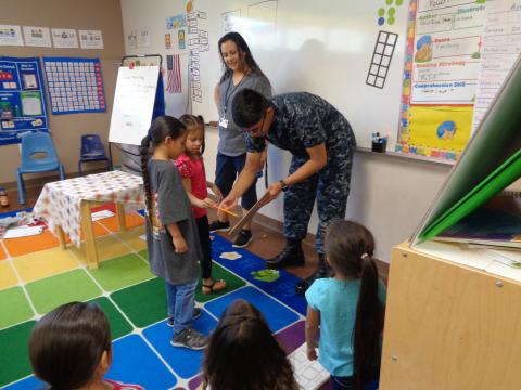 Frank Red-Bow Basquez Gallerito of the U.S. Navy visits the kindergarten class of his cousin Eti’tish Suun Arviso for a recent Show and Tell Frank Red-Bow Basquez Gallerito of the U.S. Navy visits the kindergarten class of his cousin Eti’tish Suun Arviso for a recent Show and Tell