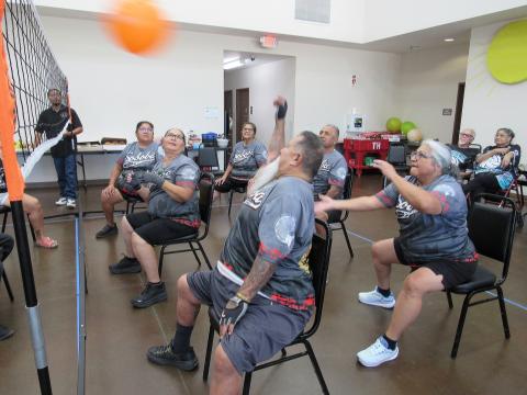 Soboba Elders player Charles Resvaloso is ready to hit the ball while Joyce Placencia, at right, prepares to back it up during a recent chair volleyball match at Soboba Soboba Elders player Charles Resvaloso is ready to hit the ball while Joyce Placencia, at right, prepares to back it up during a recent chair volleyball match at Soboba