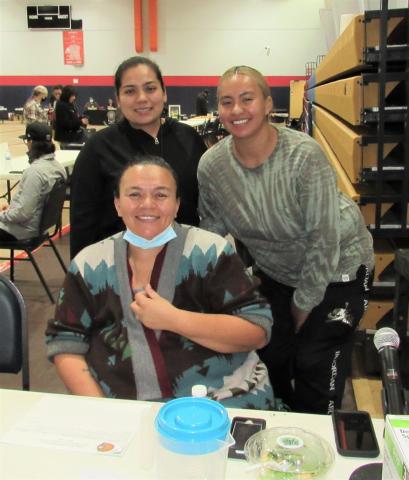 Kelli Hurtado, seated, with her daughters Sasha and Natasha, at the Body, Mind and Spirit Wellness Fair she organized at the Soboba Sports Complex on Oct. 25