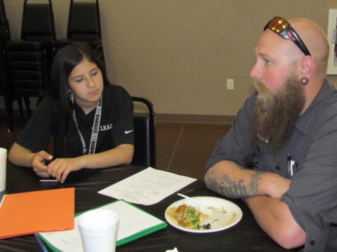 Francisca Rivera, 14, listens to Will Booth explain a little about the Public Works Department Fleet Maintenance job she signed up for through the WE LEAD work experience program Francisca Rivera, 14, listens to Will Booth explain a little about the Public Works Department Fleet Maintenance job she signed up for through the WE LEAD work experience program