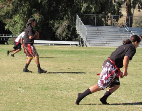 Isaac Johnson, center, waits for his teammates to run down field so he can pass the football to one of them during the Soboba Youth Turkey Bowl on Nov. 21 Isaac Johnson, center, waits for his teammates to run down field so he can pass the football to one of them during the Soboba Youth Turkey Bowl on Nov. 21