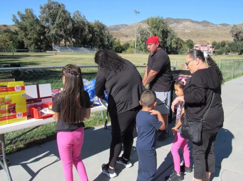Soboba Parks and Recreation Sports Coordinator Steve Lopez, center, grills up hot dogs and hamburgers for those attending the annual Soboba Youth Turkey Bowl and the Paint Workshop hosted by Soboba Tribal TANF Soboba Parks and Recreation Sports Coordinator Steve Lopez, center, grills up hot dogs and hamburgers for those attending the annual Soboba Youth Turkey Bowl and the Paint Workshop hosted by Soboba Tribal TANF